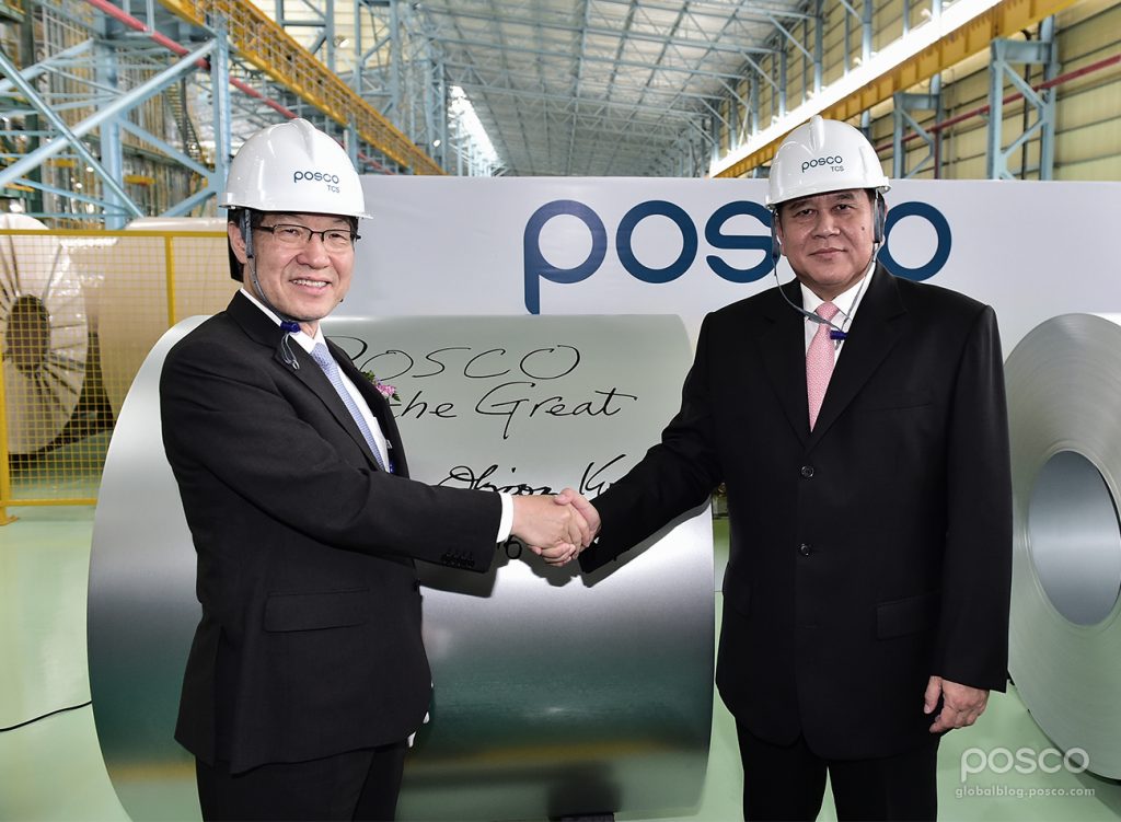 POSCO CEO Ohjoon Kwon and Deputy Prime Minister and Minister for Foreign Affairs Tanasak Patimaprakorn shake hands at hands after handwriting a message on a coil produced in Thailand CGL