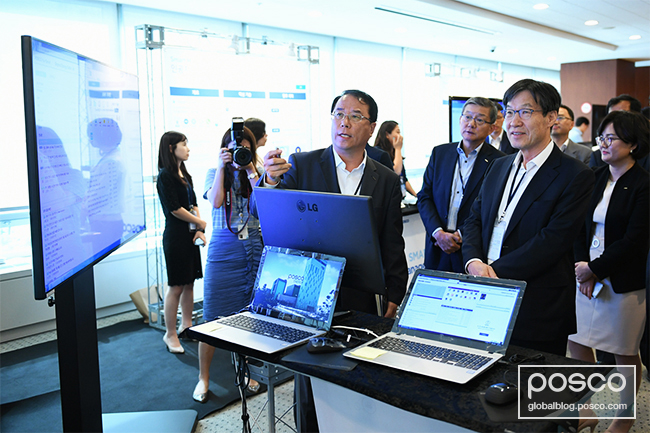 POSCO CEO Ohjoon Kwon watching a presentation at the forum