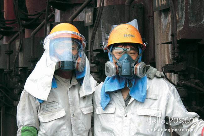 POSCO Family ‘Sejongro’ employees pose at Pohang 3rd Cokes Factory in heatproof gears and masks