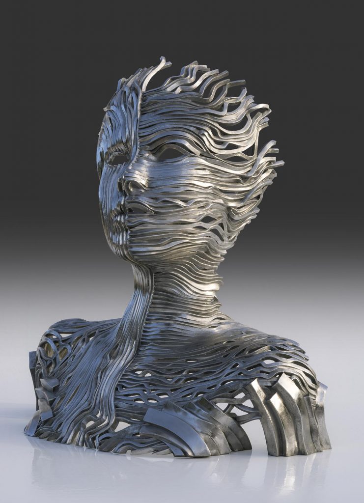 Gil Bruvel’s Dichotomy sculpture uses ribbons of energy to show two sides of the human form.