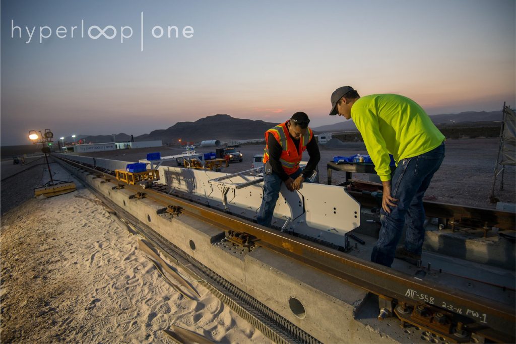 Workers install Hyperloop’s stator blocks at our test and development site in North Las Vegas