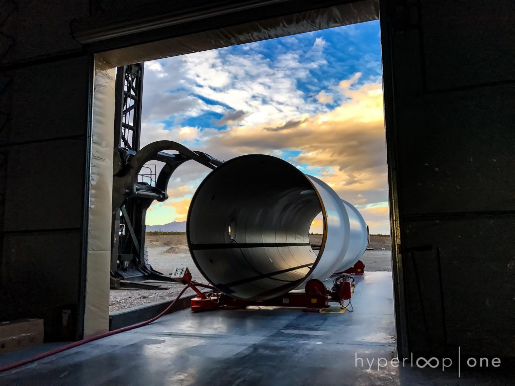 A Hyperloop steel tube awaits entry into the tube processing building, where they are painted and prepped for use.