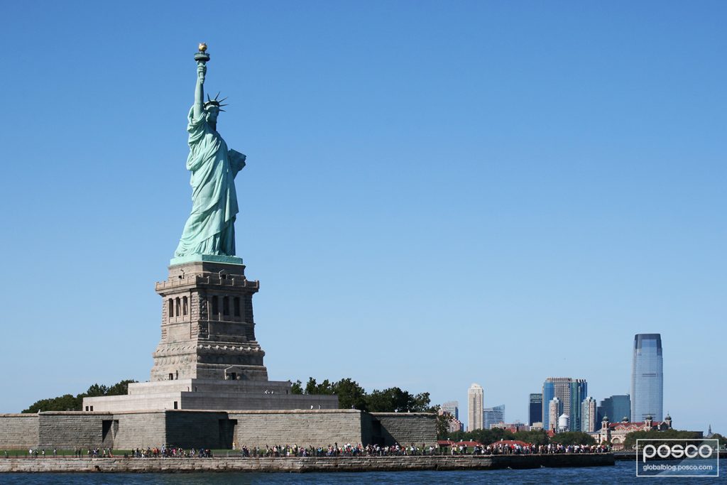 The Statue of Liberty against a clear blue sky