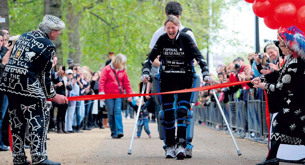 Claire L. uses a ReWalk exoskeleton to complete a race
