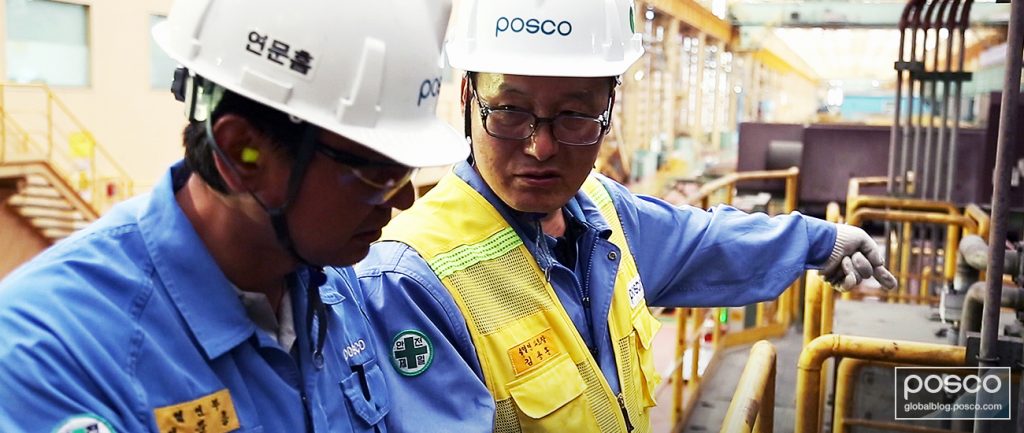 Kim Yong-Hoon with a colleague at a POSCO steel mill.