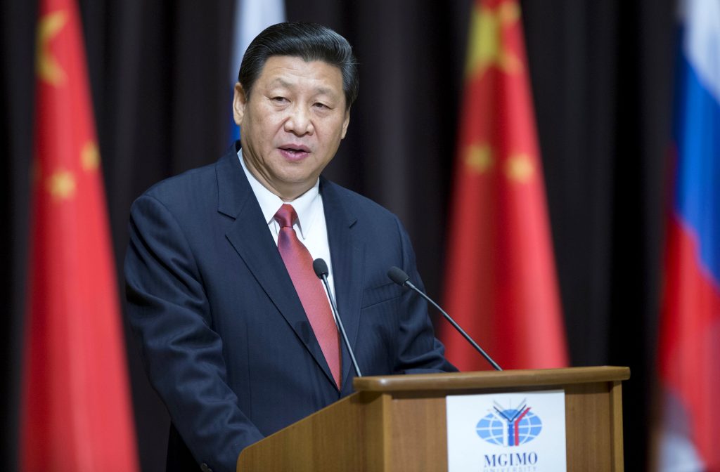 Chinese President Xi Jinping speaking at a podium. 