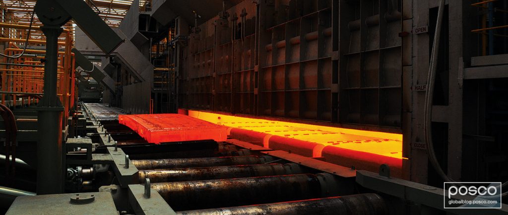 Red hot molten steel getting rolled.