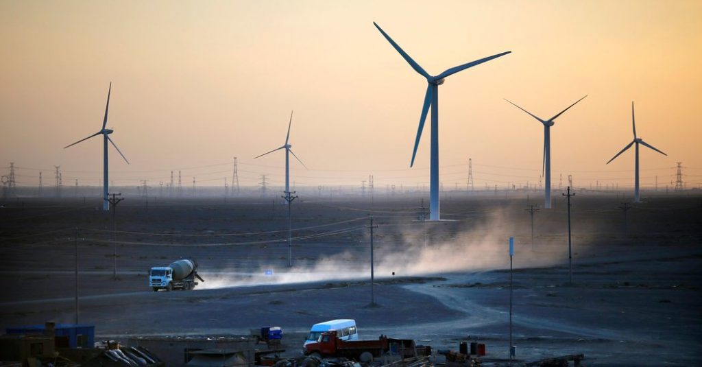 The Jiuquan Wind Power Base in China at sunset.