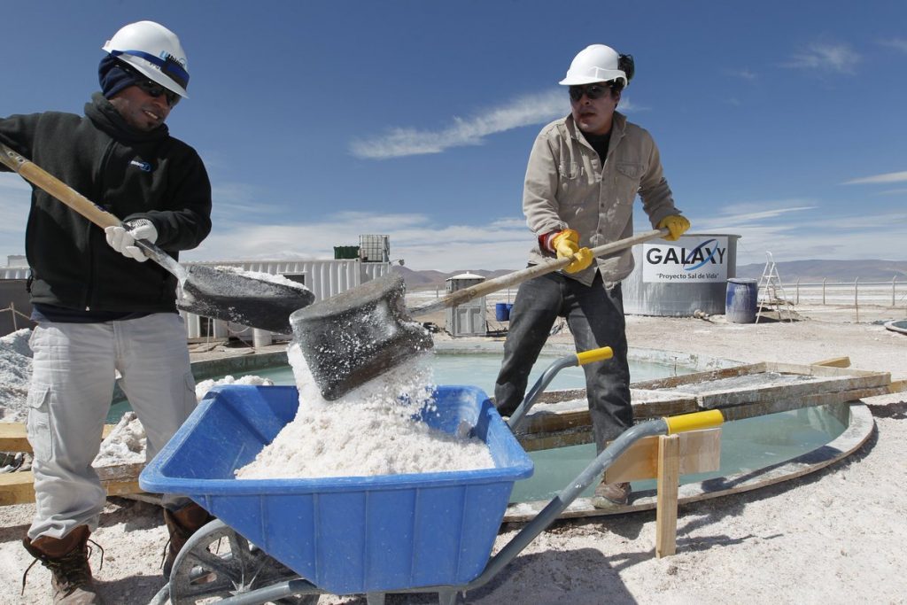Two South American Miners working at a lithium mine.